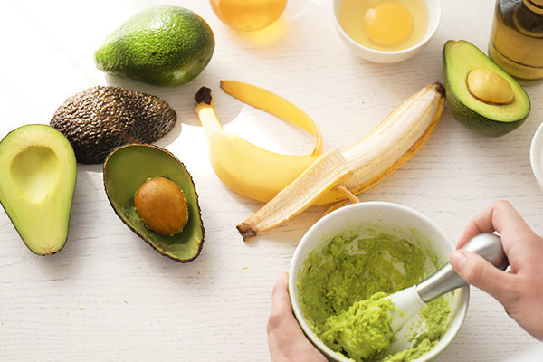 prepare and apply avocado egg and banana hair mask