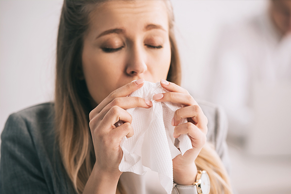 complications associated with holding back a sneeze