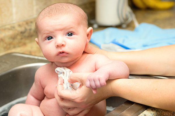 to reduce fever in small babies give them a sponge bath
