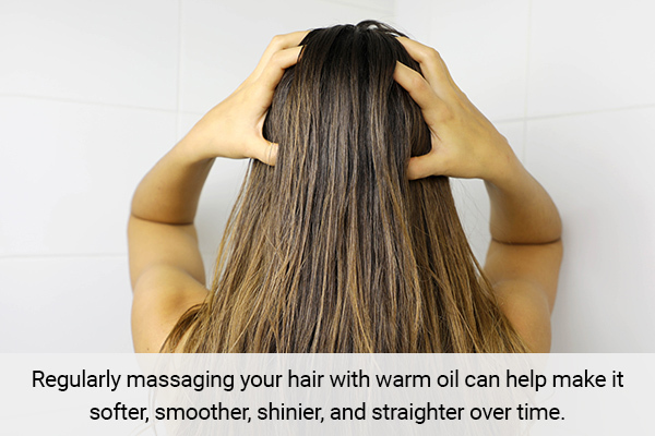 massaging your hair with warm oil can help you achieve straight hair